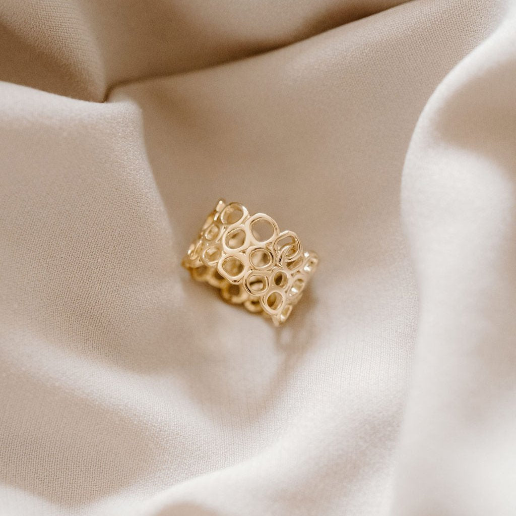 Beauty within inspired jewellery, wrapped in cream blanket.