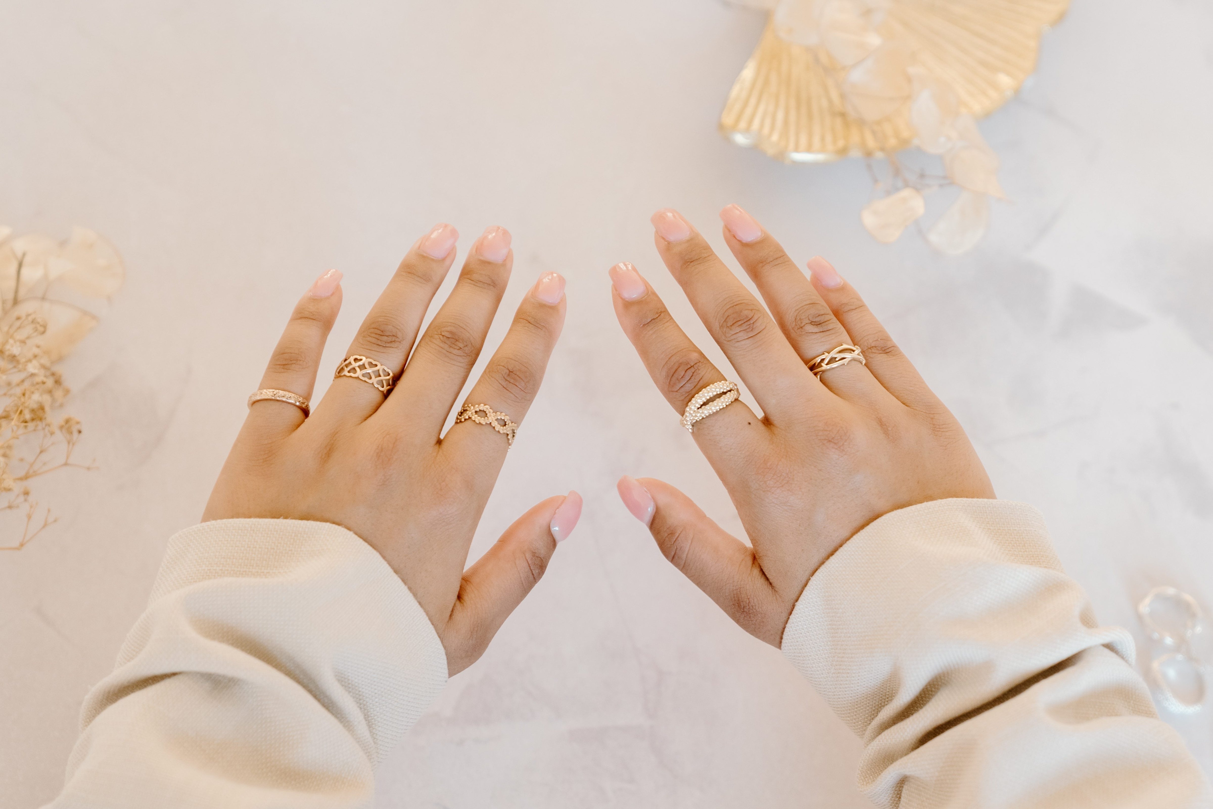 Handcrafted gold rings, with unique designs.