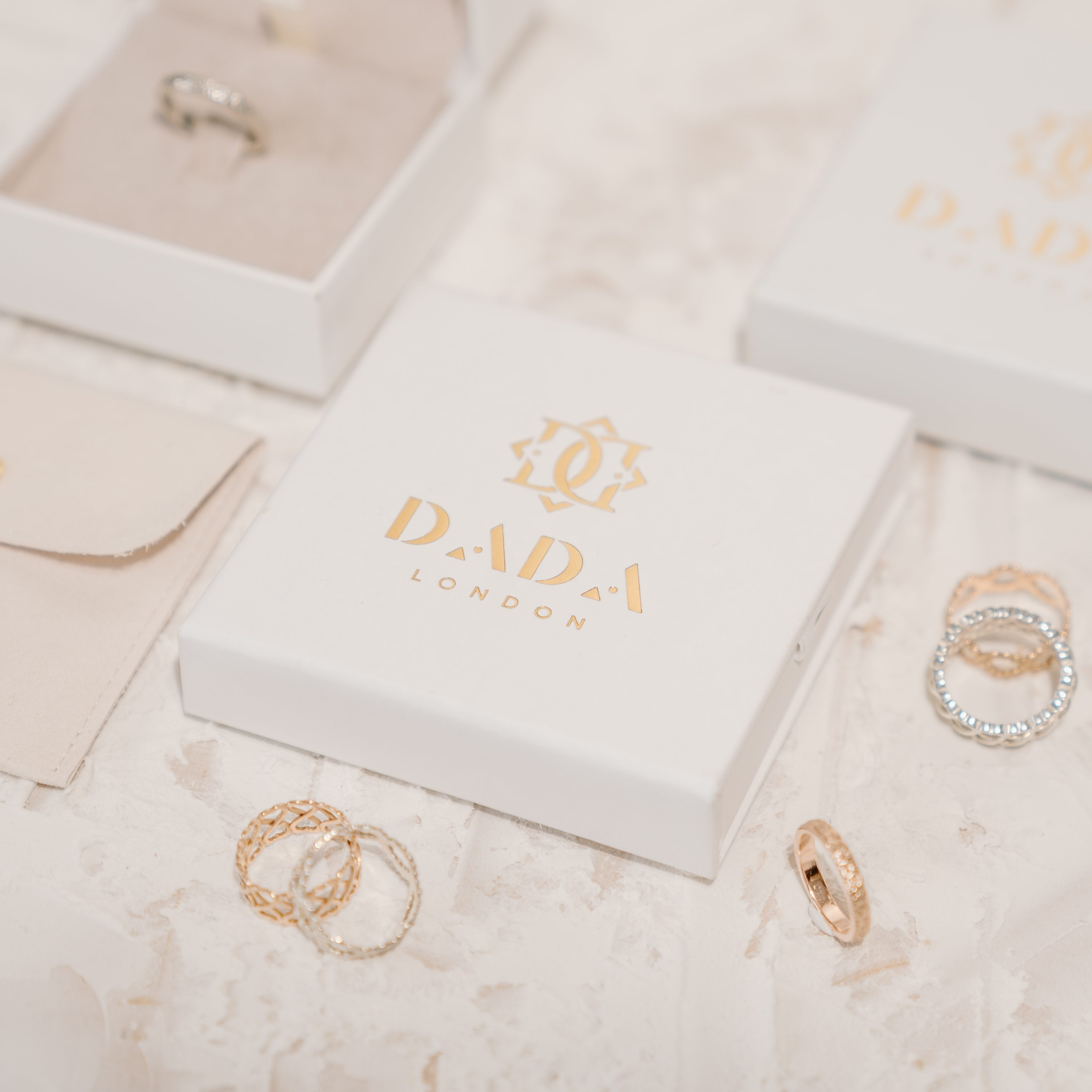 Love rings surrounded by sustainable jewellery packaging.