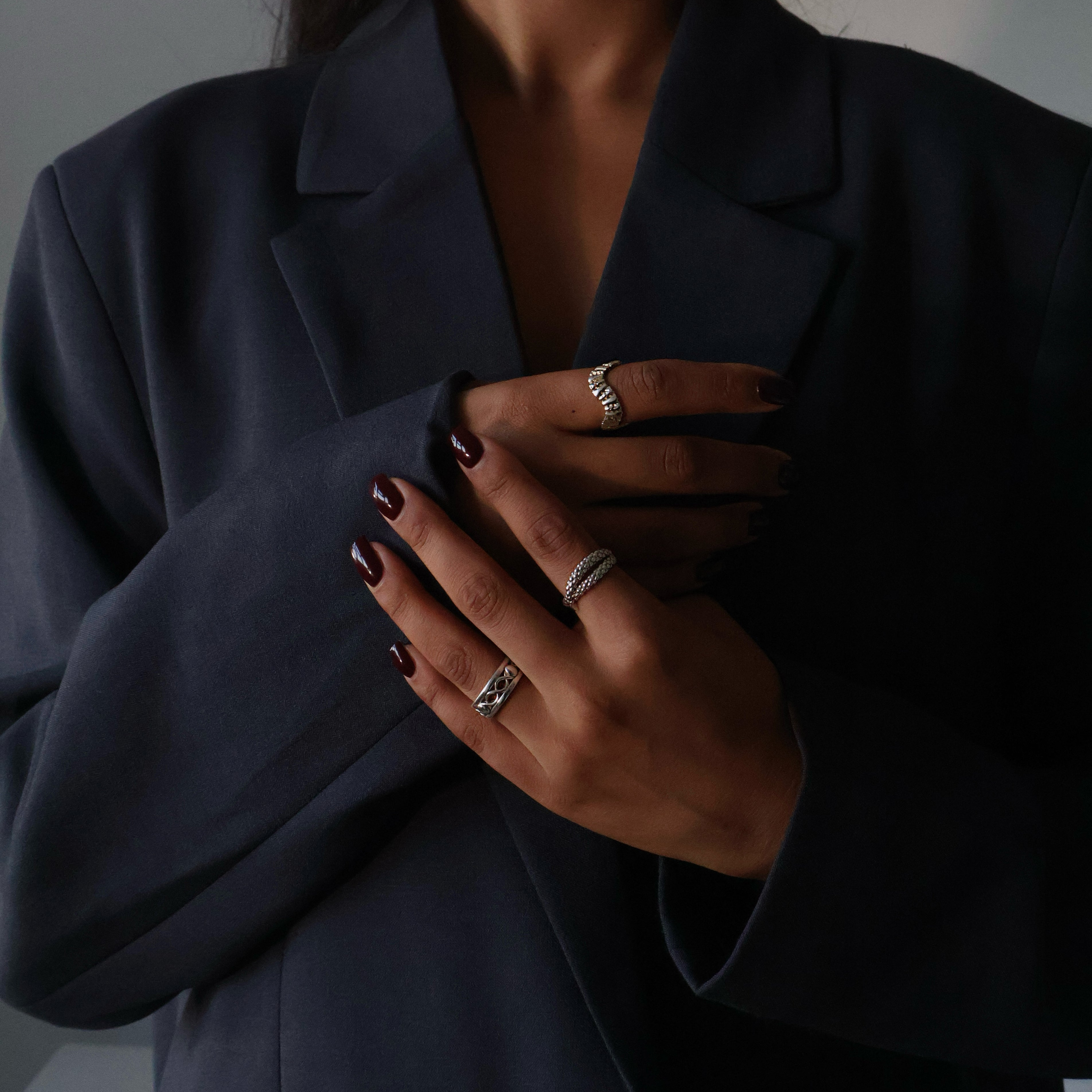 Corporate girl modelling pretty silver jewellery.