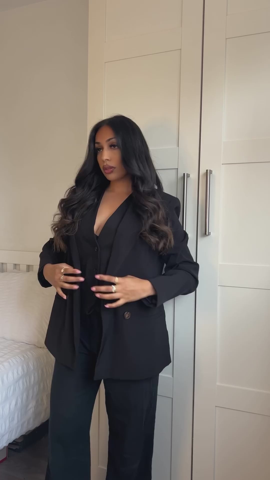 Styling gold rings, on sexy, smart, independent girl dressed in smart casual clothing.
