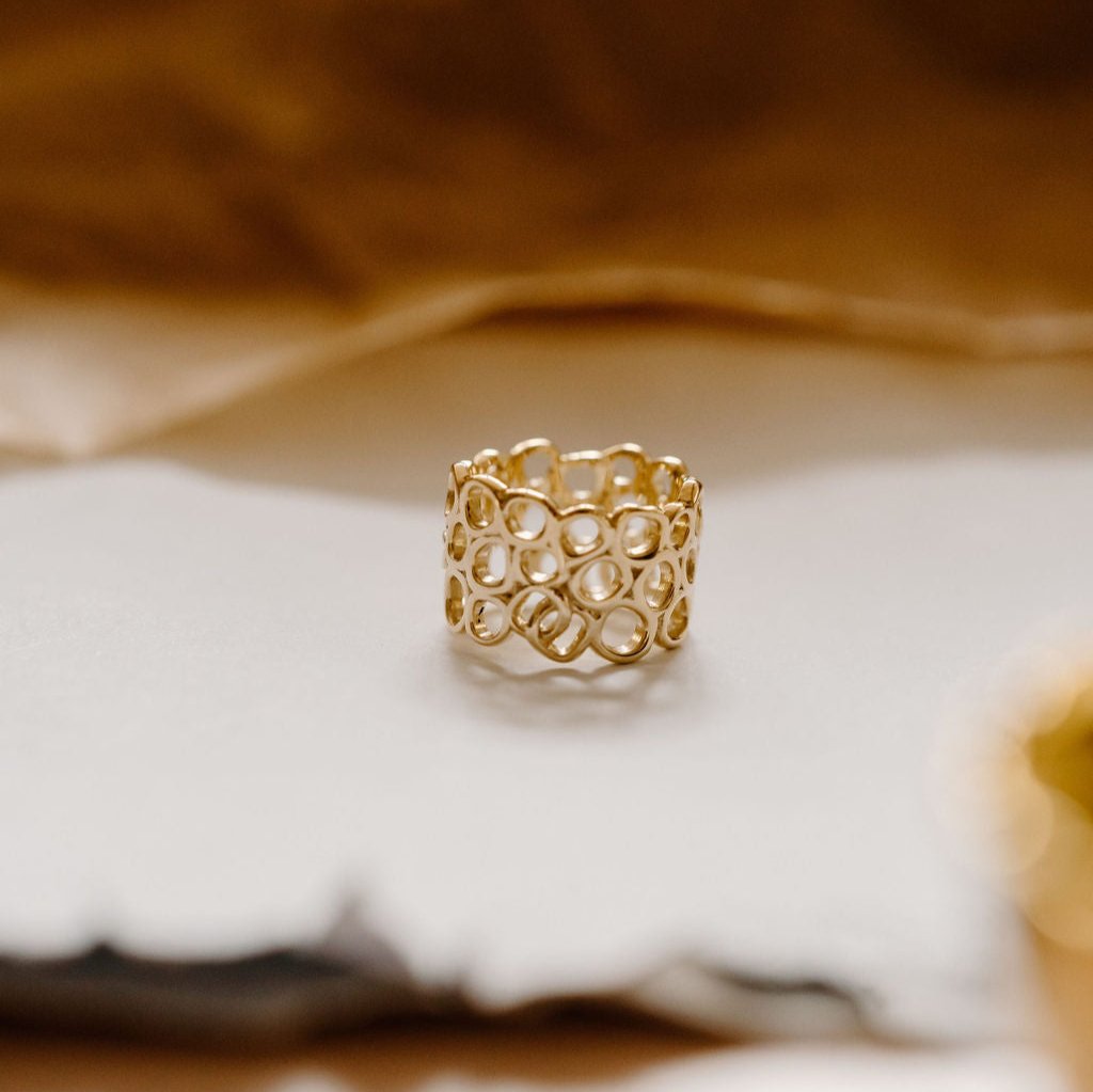 Beauty within ring on table surrounded by brown wool.