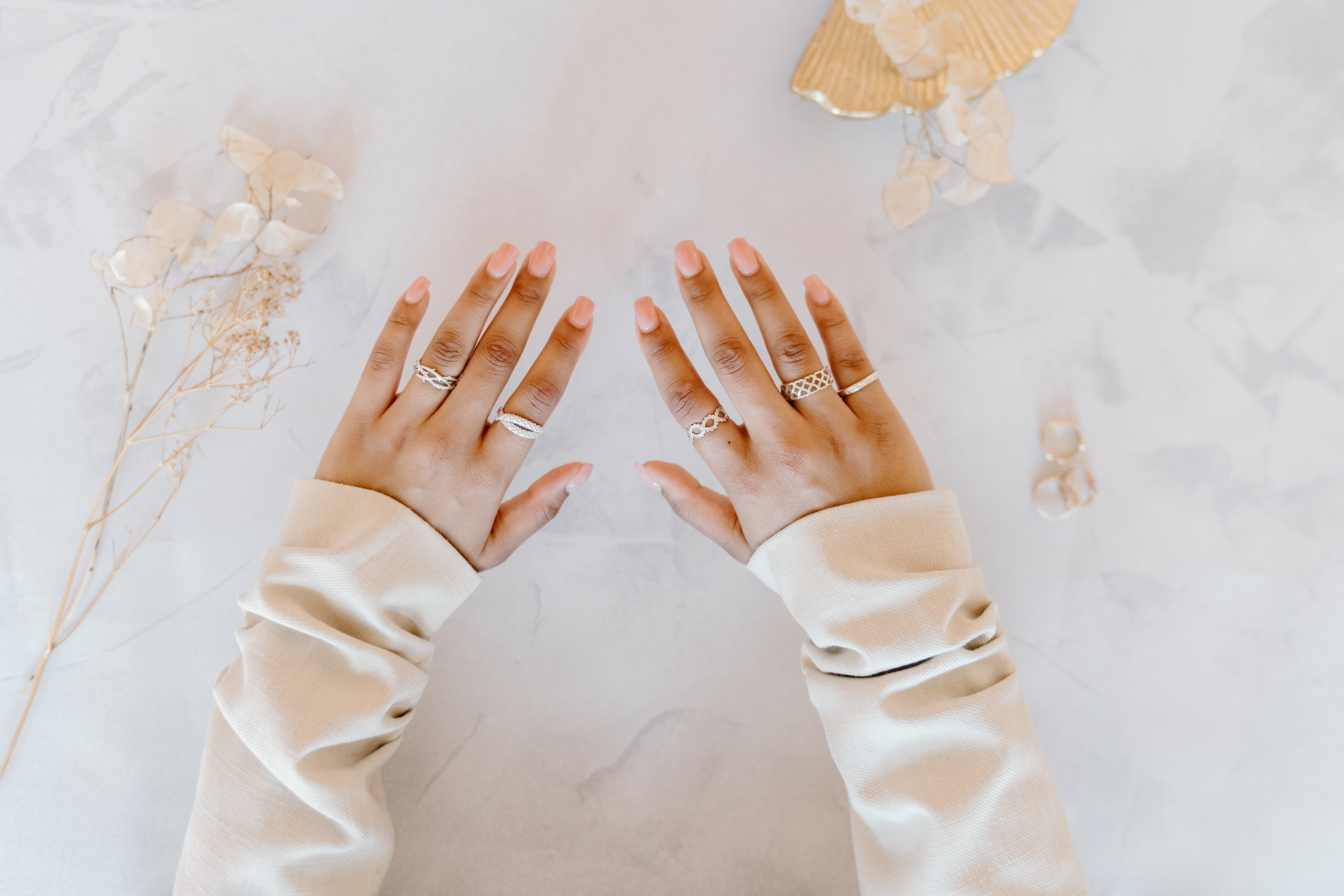 Luxury Silver rings with pink nails.