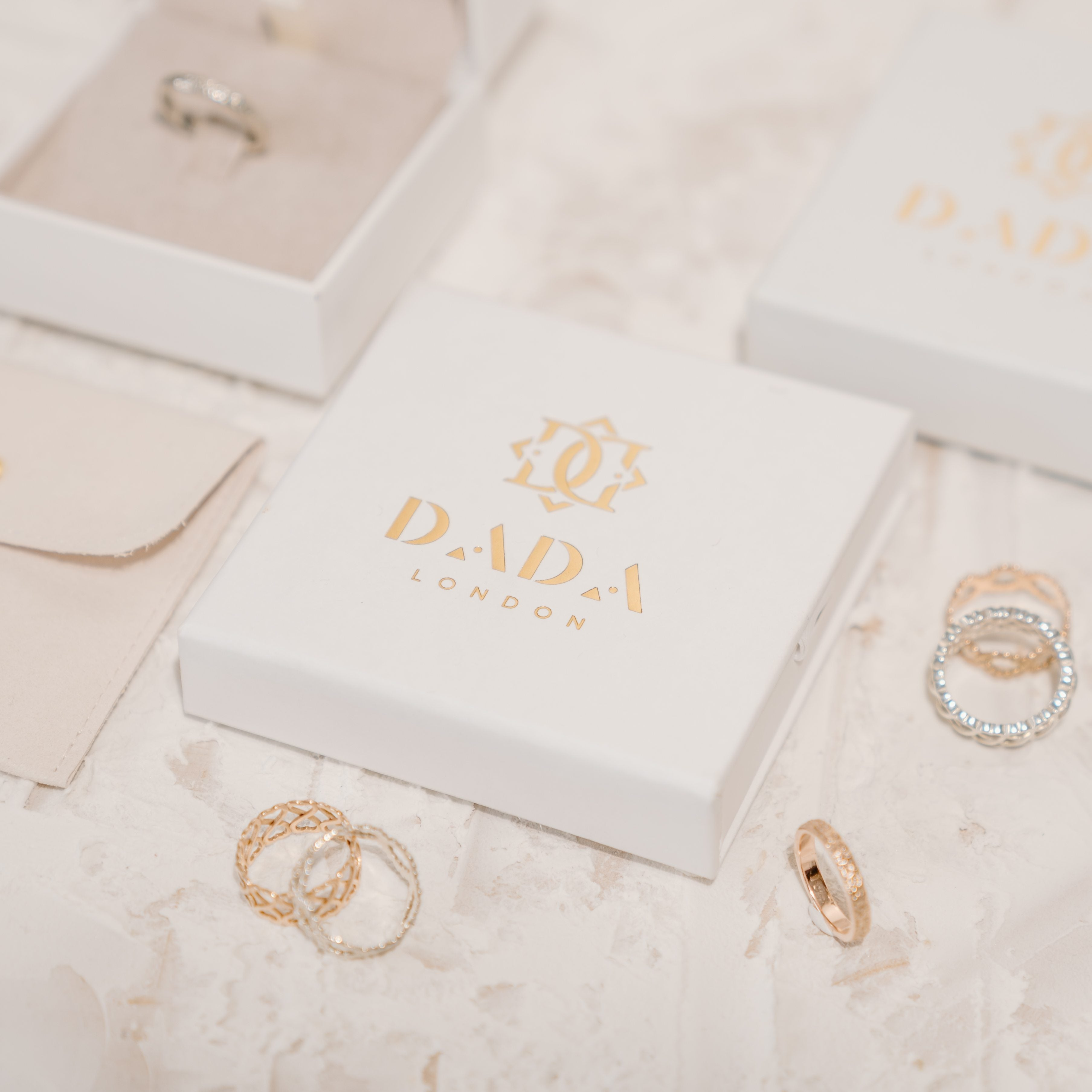 Love rings surrounded by sustainable jewellery packaging. 