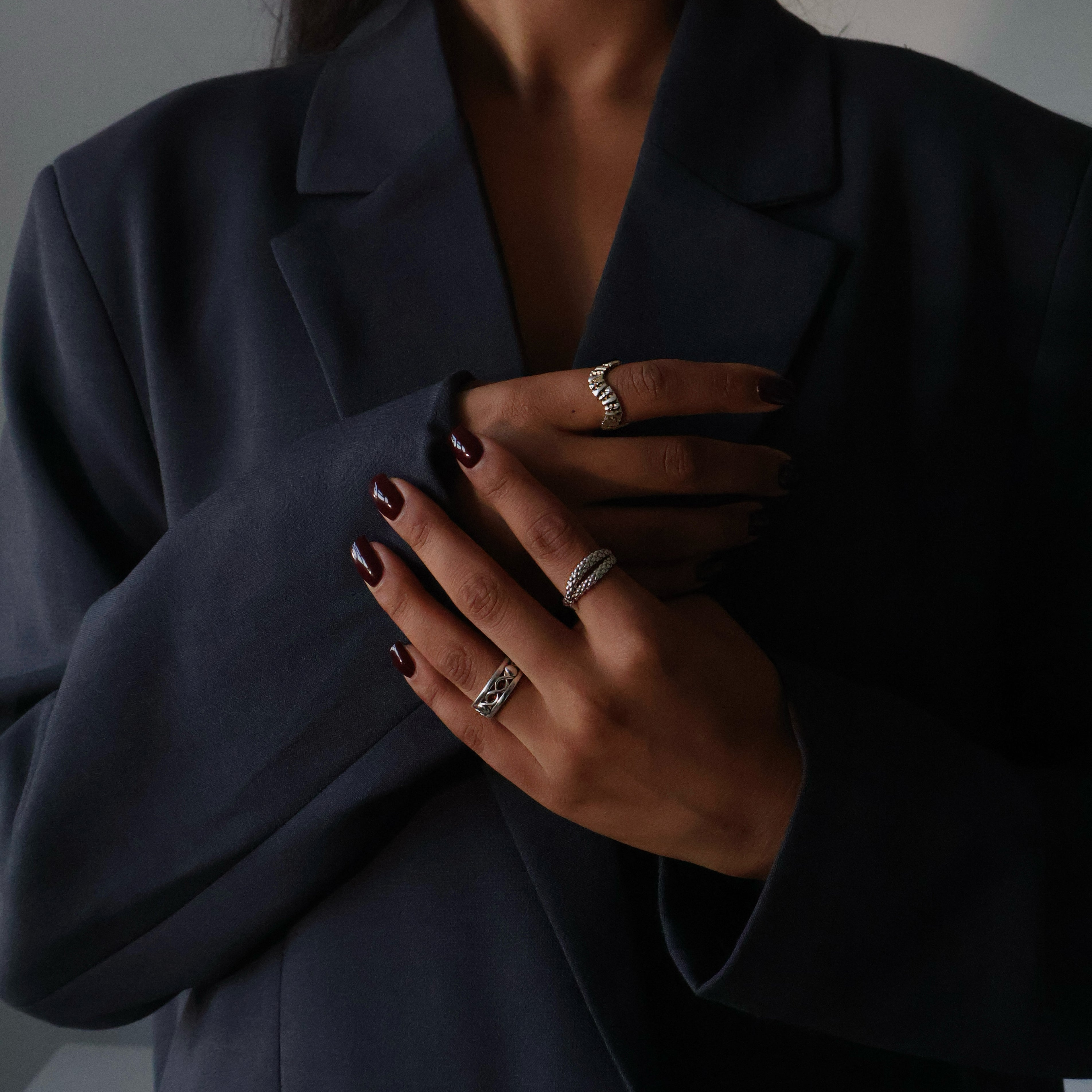 Corporate girl modelling pretty silver jewellery.  