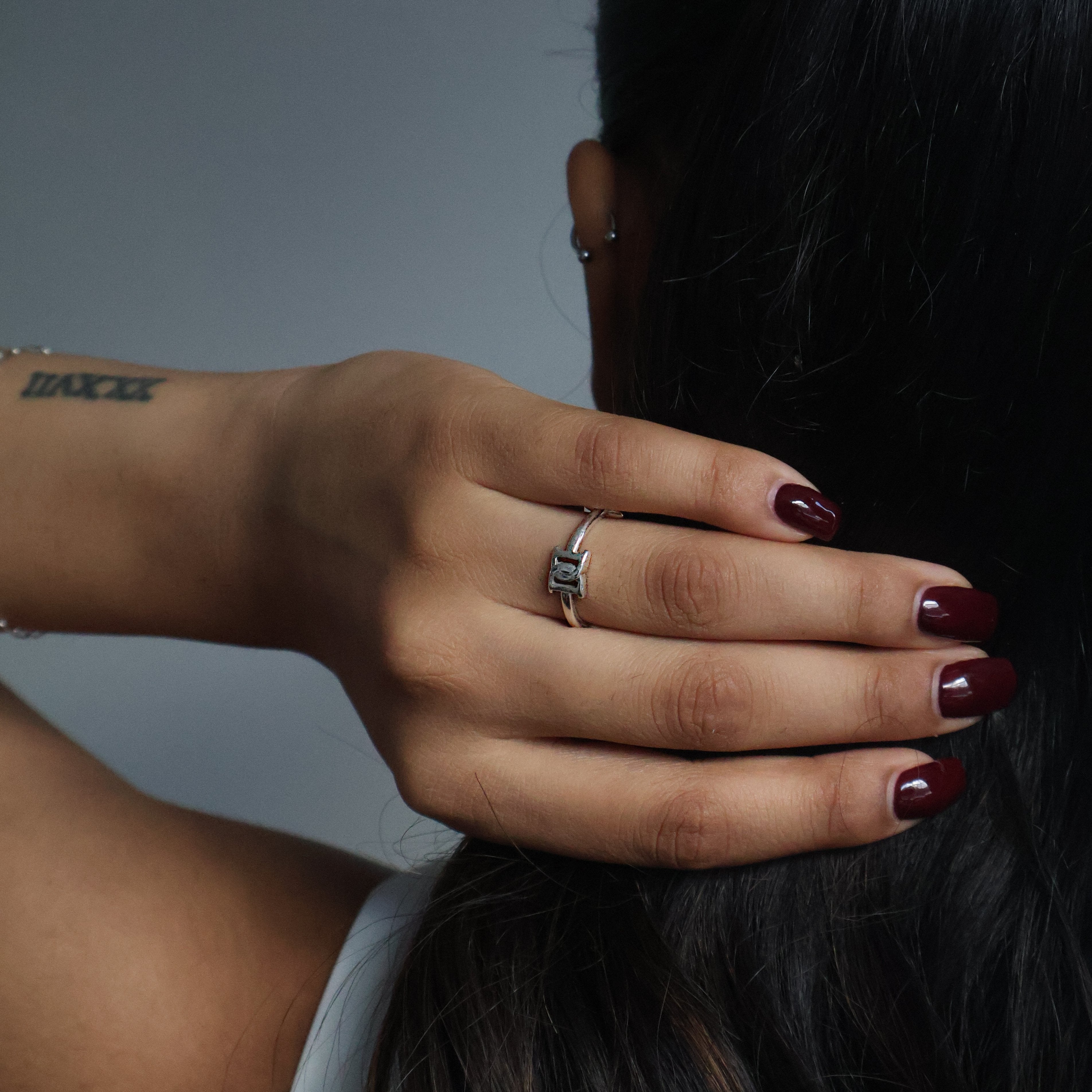 Love ring, with girl holding her hair elegantly. 